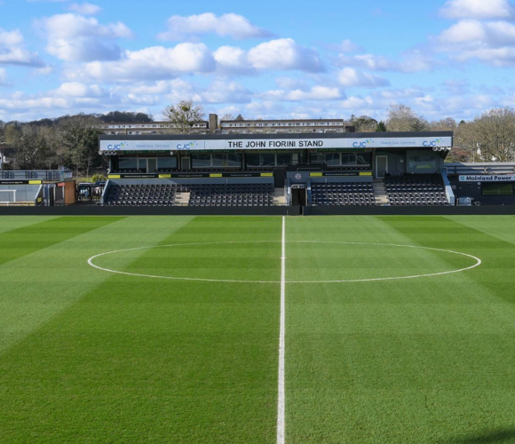 Photograph of The John Fiorini Stand and pitch at Bromley FC's Copperjax Community Stadium