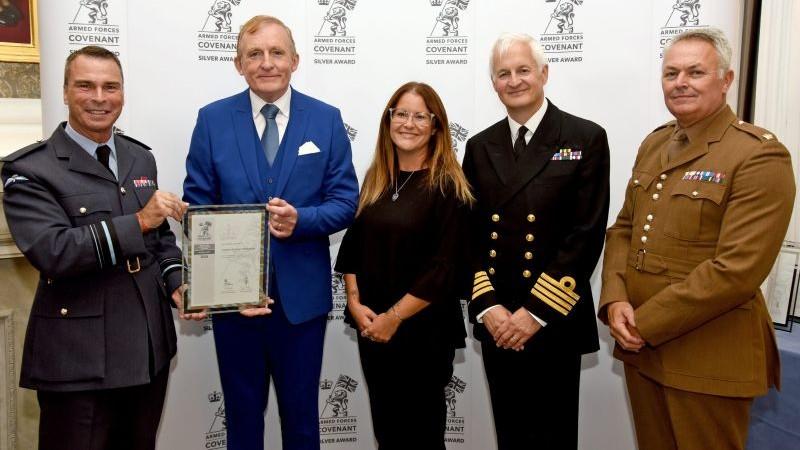 Armed Forces Champion Councillor Botting receiving the Silver Award certificate at the ceremony.