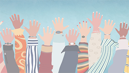 Image shows lots of hands being held up in the air.