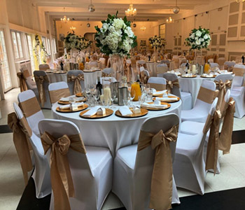 Club Langley ceremony room with decorated cabaret style tables.