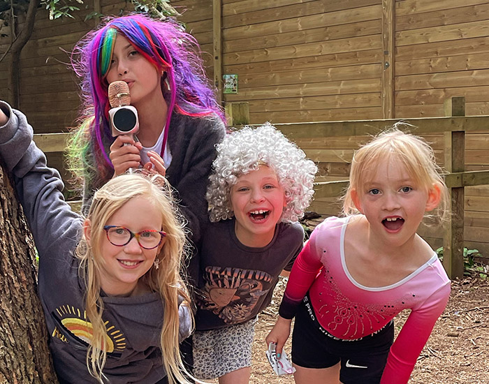 BStarz Drama Camp - Bromley High School: Photo of four girls in fancy dress, stood together outside
