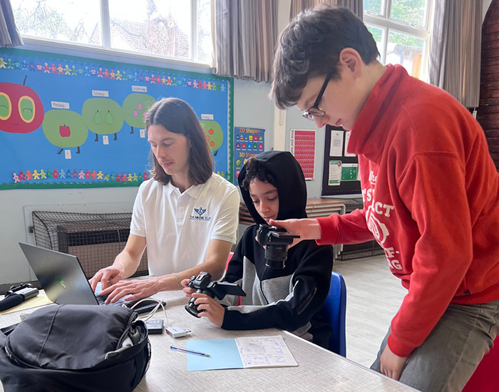 Music Klub - Anerley Methodist Church: Photo of two children and an instructor working with cameras.