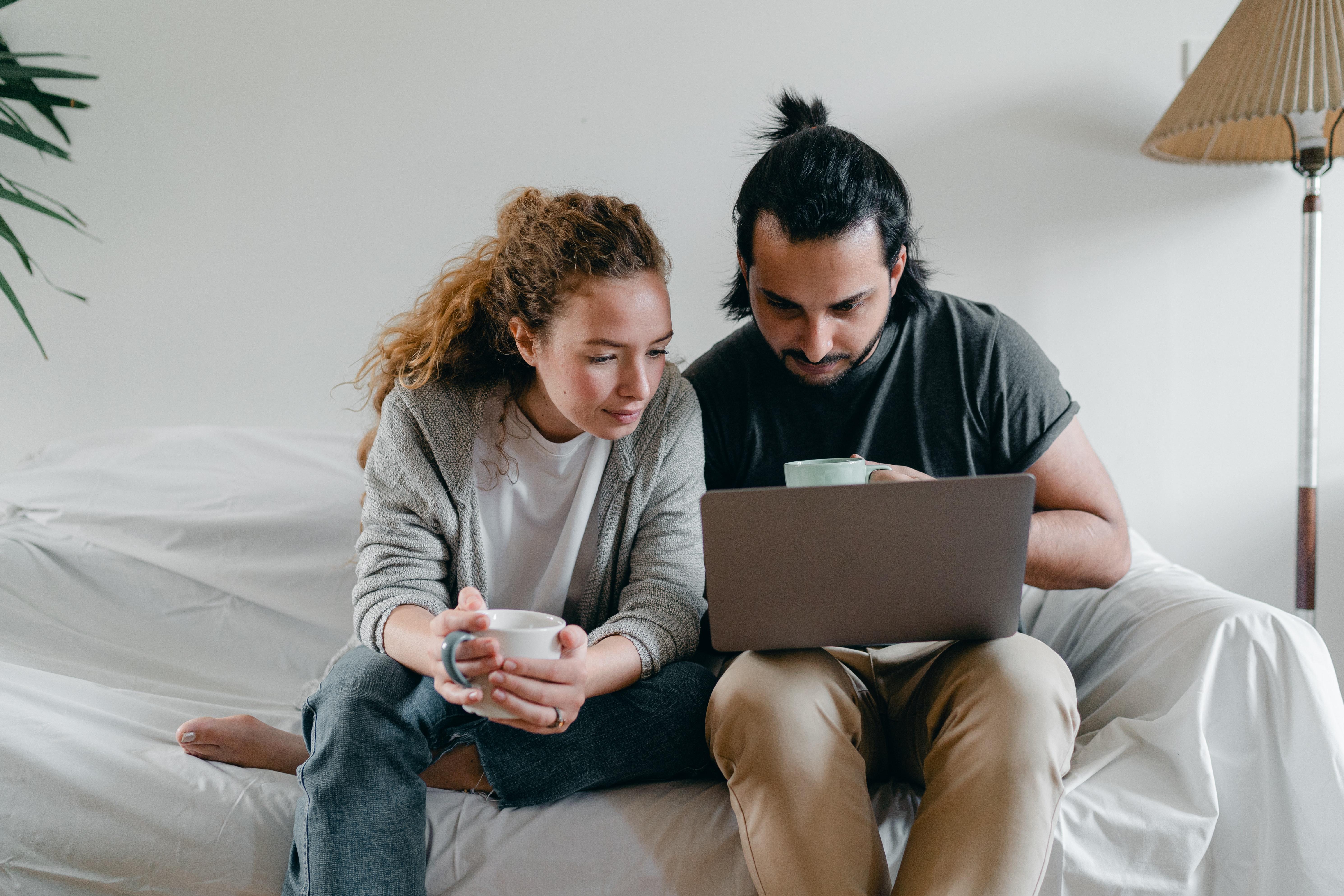 Two people with laptop computer
