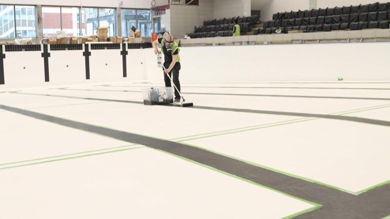 Lane lines being painted on the Walnuts Leisure Centre pool.