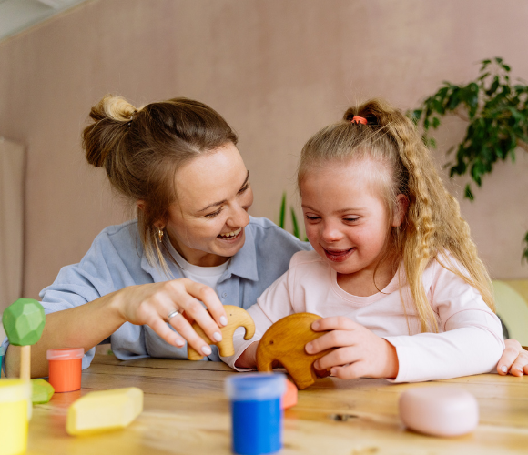 A child and parent playing with toys.