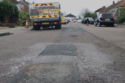 Picture of potholes recently fixed and road open again.