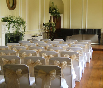 Georgian style ceremony room at the Ripley Arts Centre featuring a grand piano.