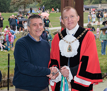 Then-Mayor of Bromley handing over key to representative of Crystal Palace Park Trust.