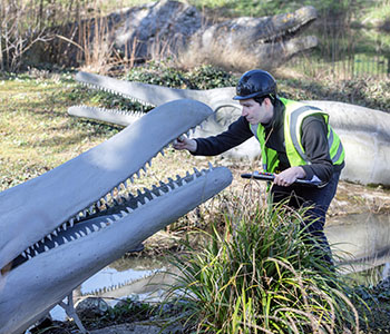Crystal Palace dinosaur being inspected. Photo credit Chris Gorman, National Lottery Heritage Fund