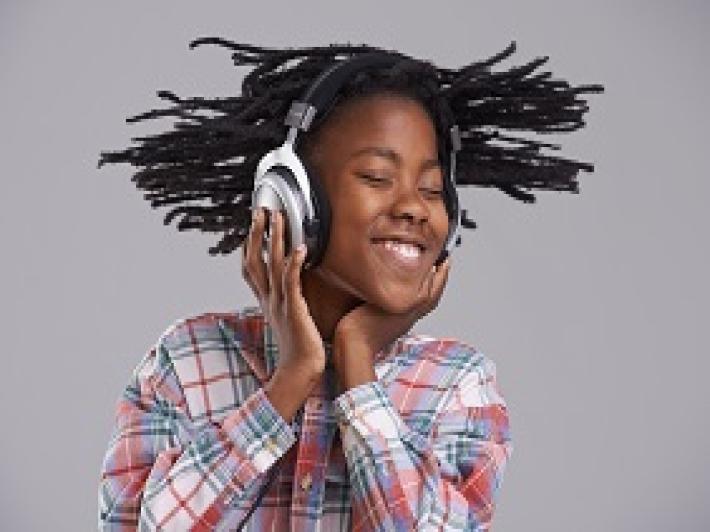 young person with headphones