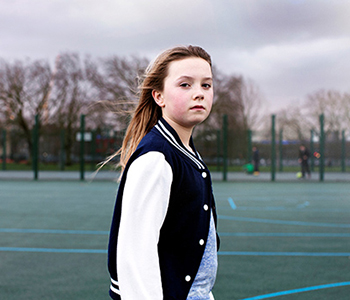 A young girl having some activity time with friends and a break away from her caring responsibilities, who is representing a young carer in the community.